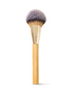 Makeup brush with wooden handle and gold ferrule on a white background