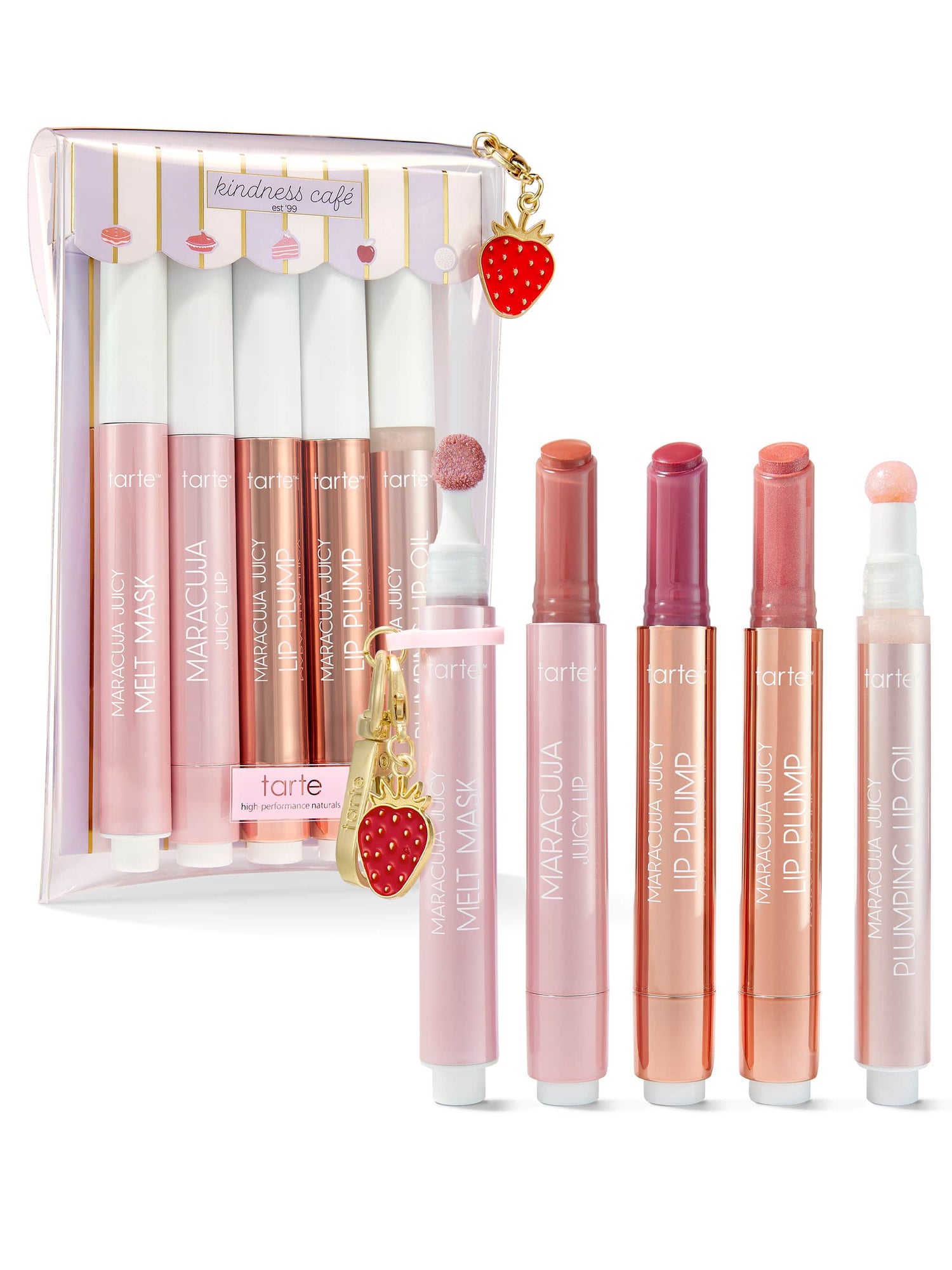 Tarte makeup set with lip products and a strawberry charm on a white background