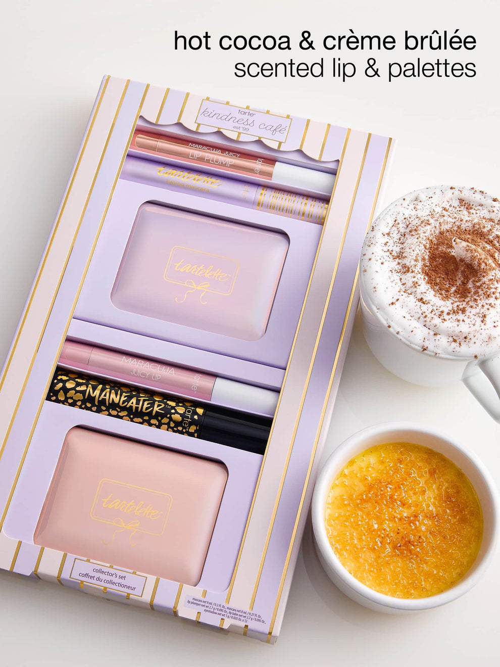 Makeup set with 'hot cocoa & crème brèlé' scented lip and palettes, next to a cup of cappuccino and bowl of crème brèlé.
