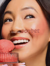 Woman holding pink sorbet with 'cool as sorbet' text overlay