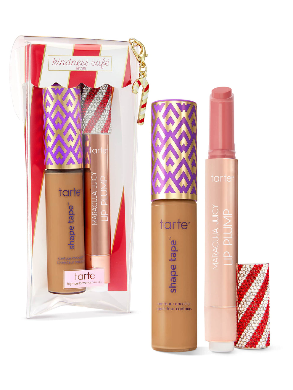 A Tarte Cosmetics concealer and lipstick set displayed in festive packaging. The concealer stands upright with purple and gold patterns, beside a pink lipstick, against a white background.