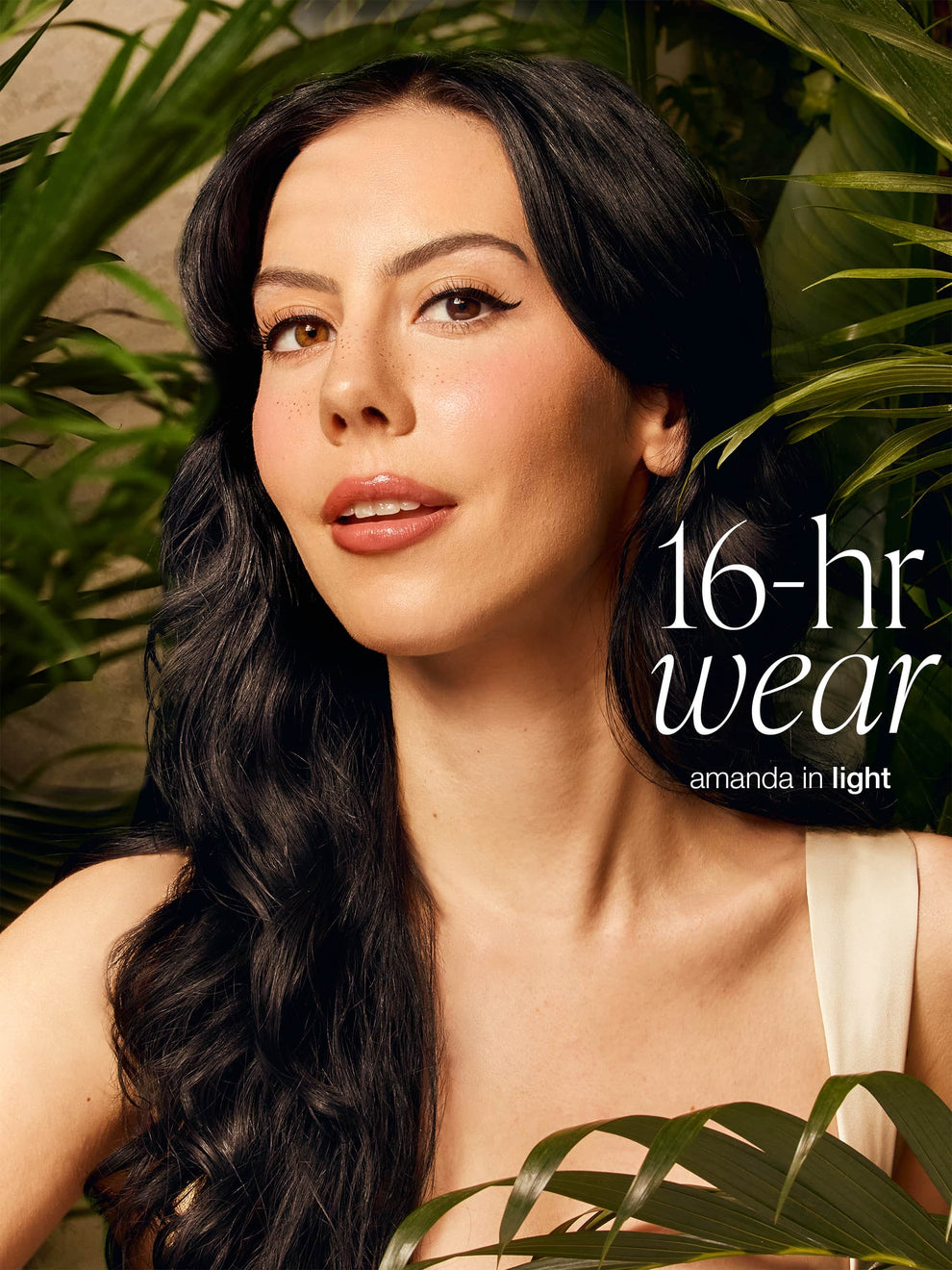  dark hair with greenery with text '16-hr wear' and 'amanda in light' wearing tarte CC serum
