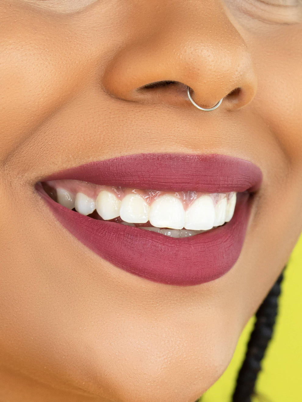 Close-up of a person's lips with a focus on the lipstick color.