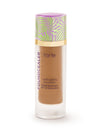 Tarte multi-tasking foundation bottle with colorful cap on a white background