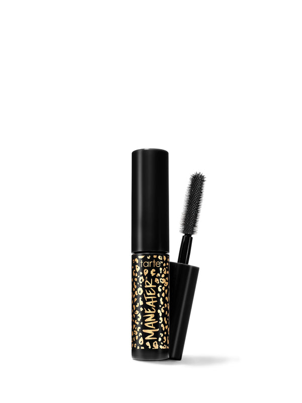 A travel-size mascara with a black tube and a brush applicator, featuring a gold and black pattern on the tube.