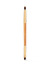 Makeup brush with wooden handle and black bristles on a white background