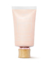Cosmetic tube with wooden cap on a white background