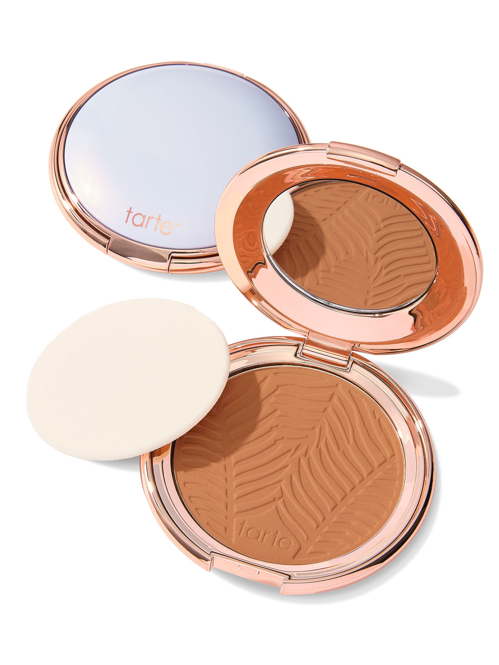 Compact powder with a zebra pattern and 'tarte' branding on a white background