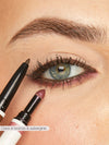 Close-up of a person applying eyeliner with a pencil and lipstick with a brush.
