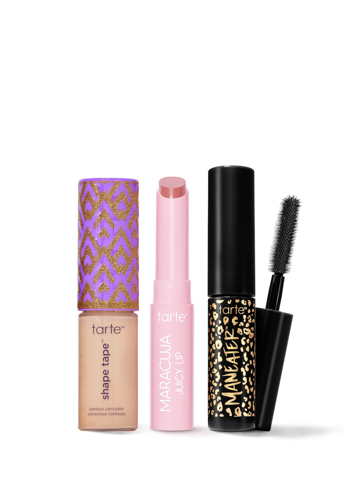 Set of Tarte makeup products including a concealer, lip balm, and mascara on a white background
