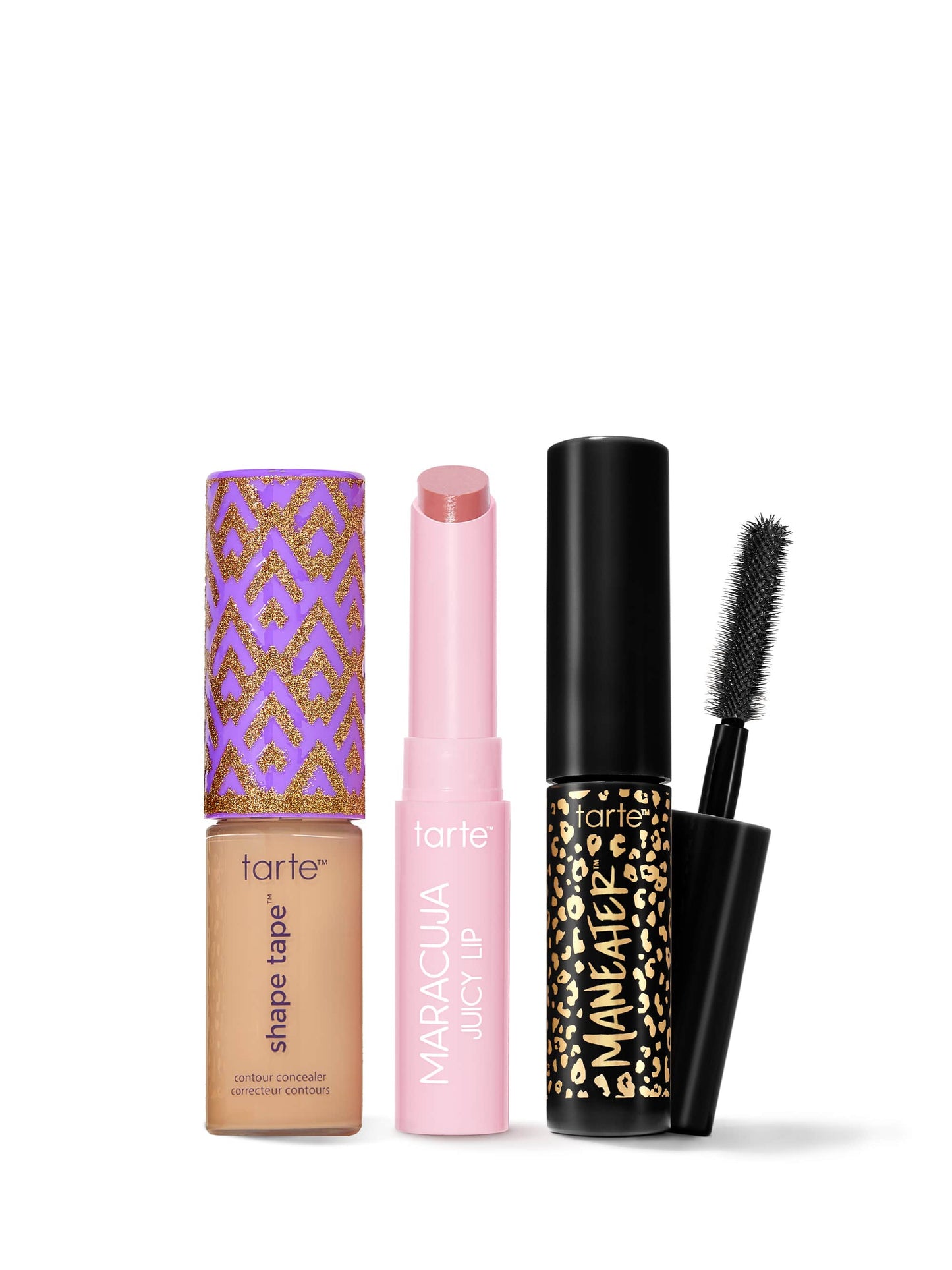 Set of Tarte makeup products including a concealer, lip balm, and mascara on a white background