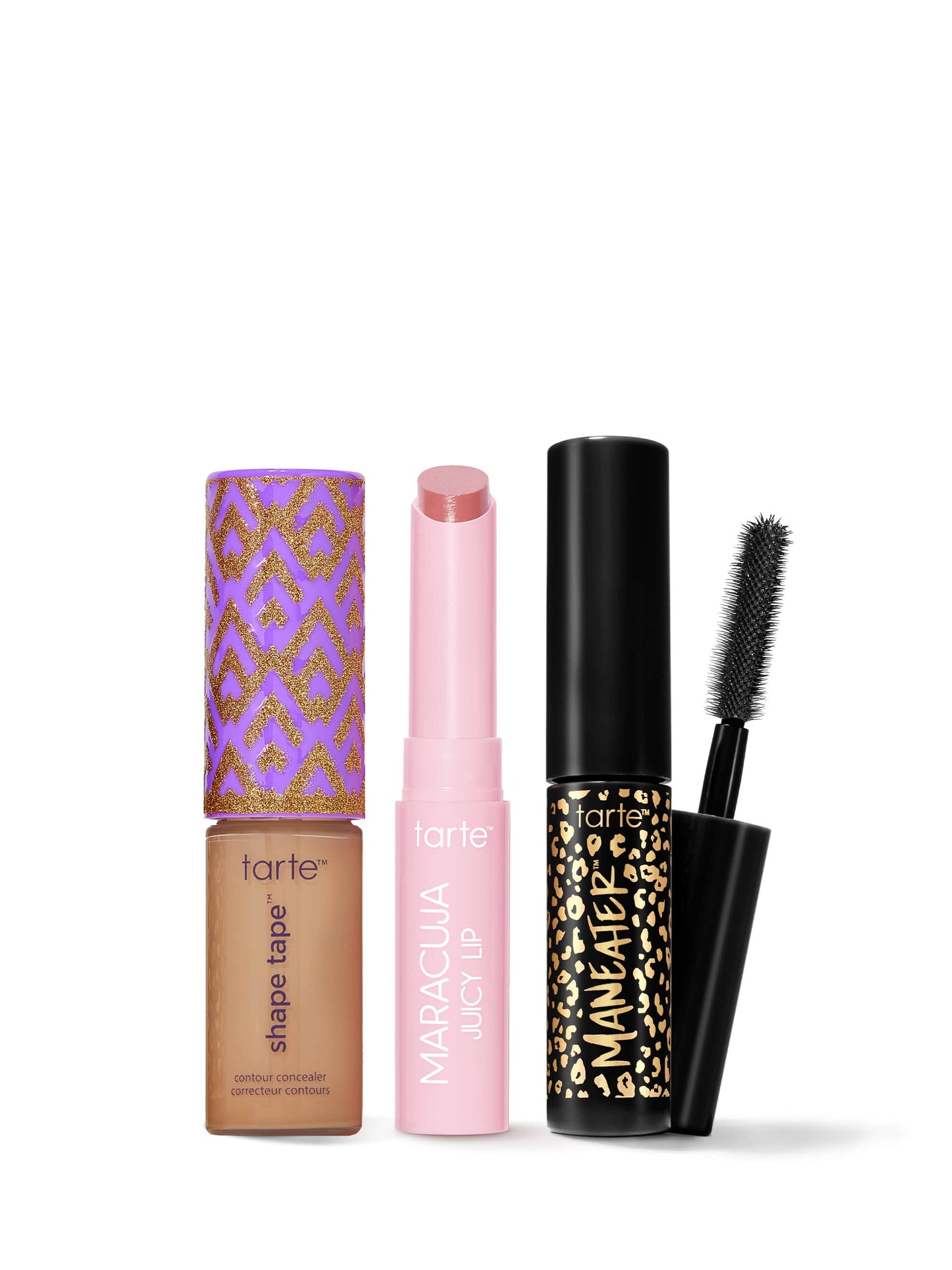Set of Tarte makeup products including a concealer, lip balm, and mascara on a white background