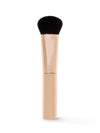 Makeup brush with black bristle head and beige handle on a white background