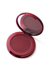 Compact blush in a red case with mirror on a white background